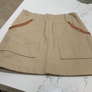 Coach, mini skirt, genuine leather trim.